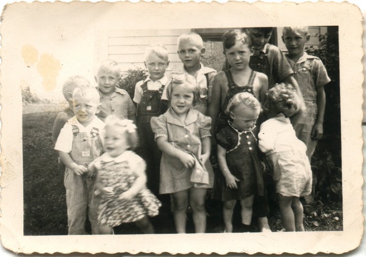 0214.jpg - Roth Cousins of the Joseph & Fannie Roth Family:  1944c  Back left:  ???, David Roth, Dennis Roth, ???, Bob Yoder, ???, Edward Roth;  Front left:  Gerri Beachy, Janet Yoder, Donna Roth, ???, ???.