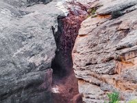 Flash at Knickpoint  With blue sky overhead, a flash flood from another place, roars and echos through the crack in the earth.